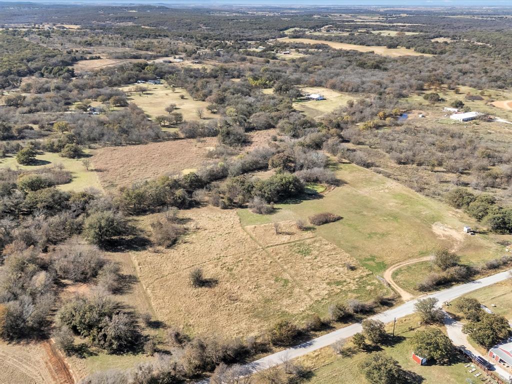 6334 Barrel Springs Road Nocona, TX 76255 - Photo 16 of 34 a view of a yard with snow on the road