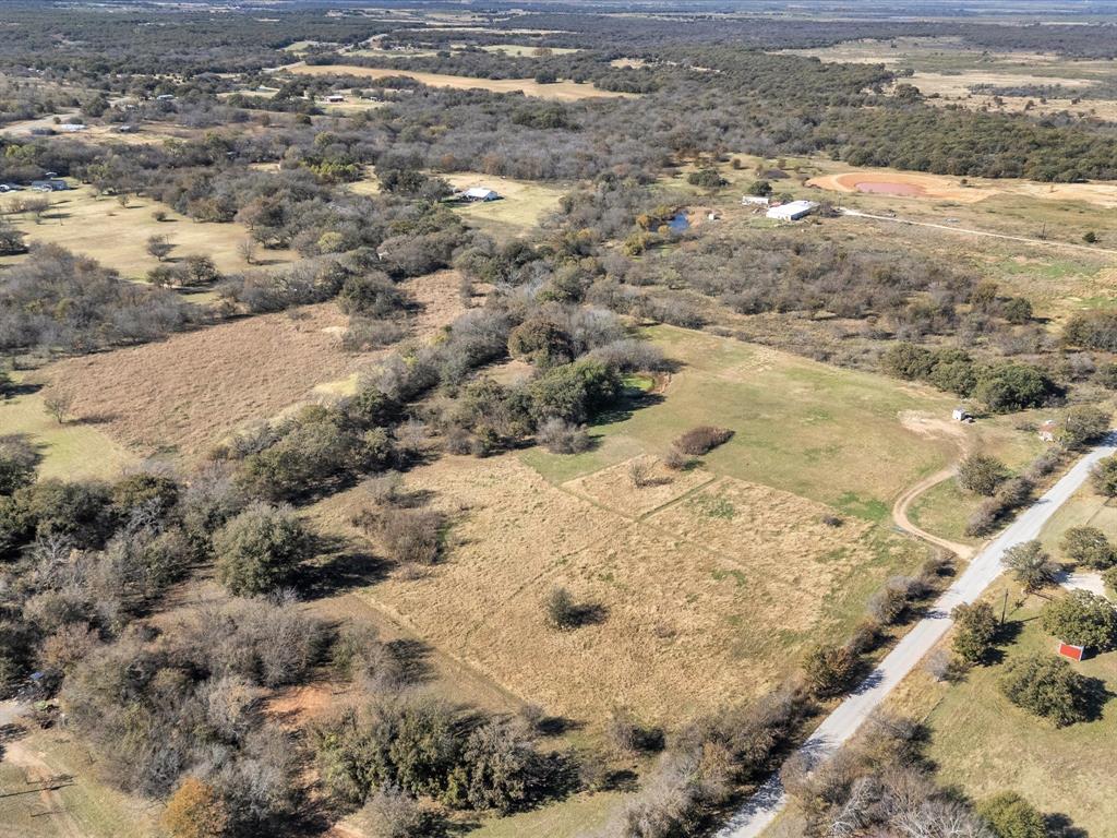 6334 Barrel Springs Road Nocona, TX 76255 - Photo 18 of 34 a view of a yard with snow on the road