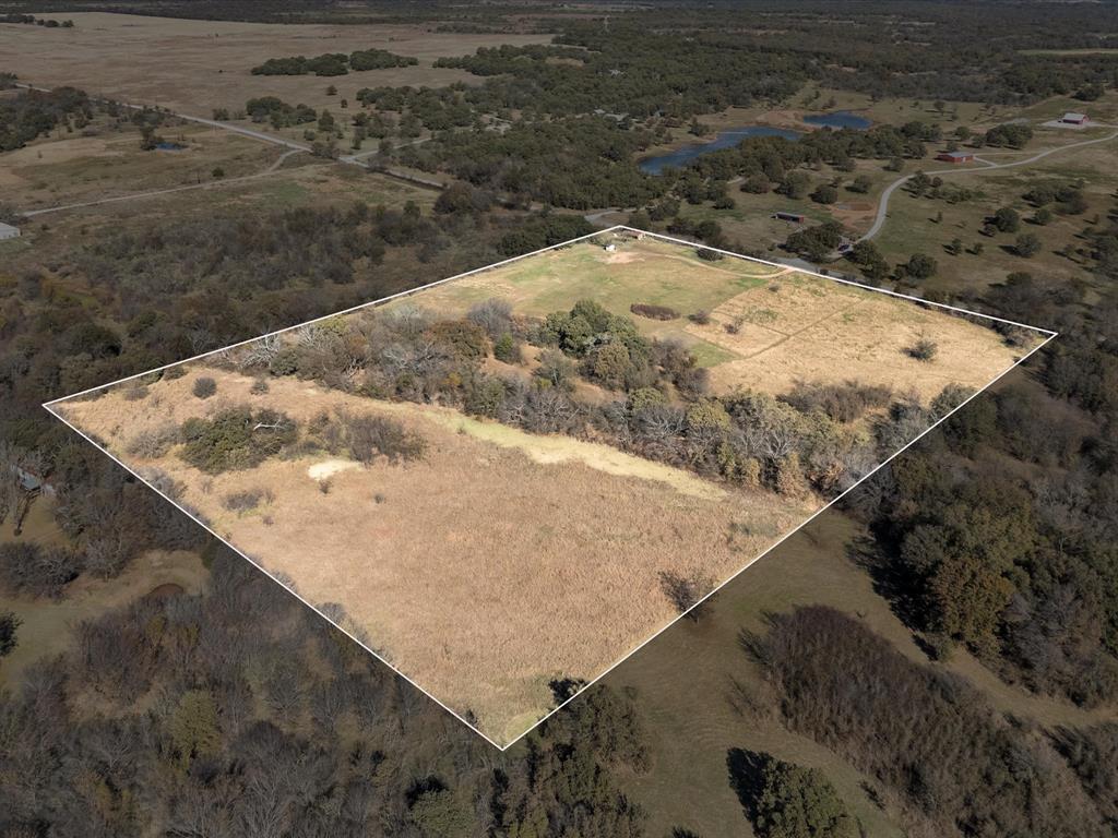 6334 Barrel Springs Road Nocona, TX 76255 - Photo 21 of 34 a view of a dry yard with mountain and lake view