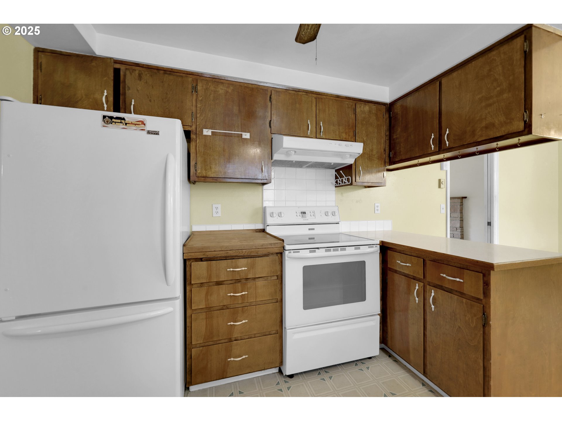 2315 19th Street Springfield, OR 97477 - Photo 11 of 30 a kitchen with a refrigerator and a stove
