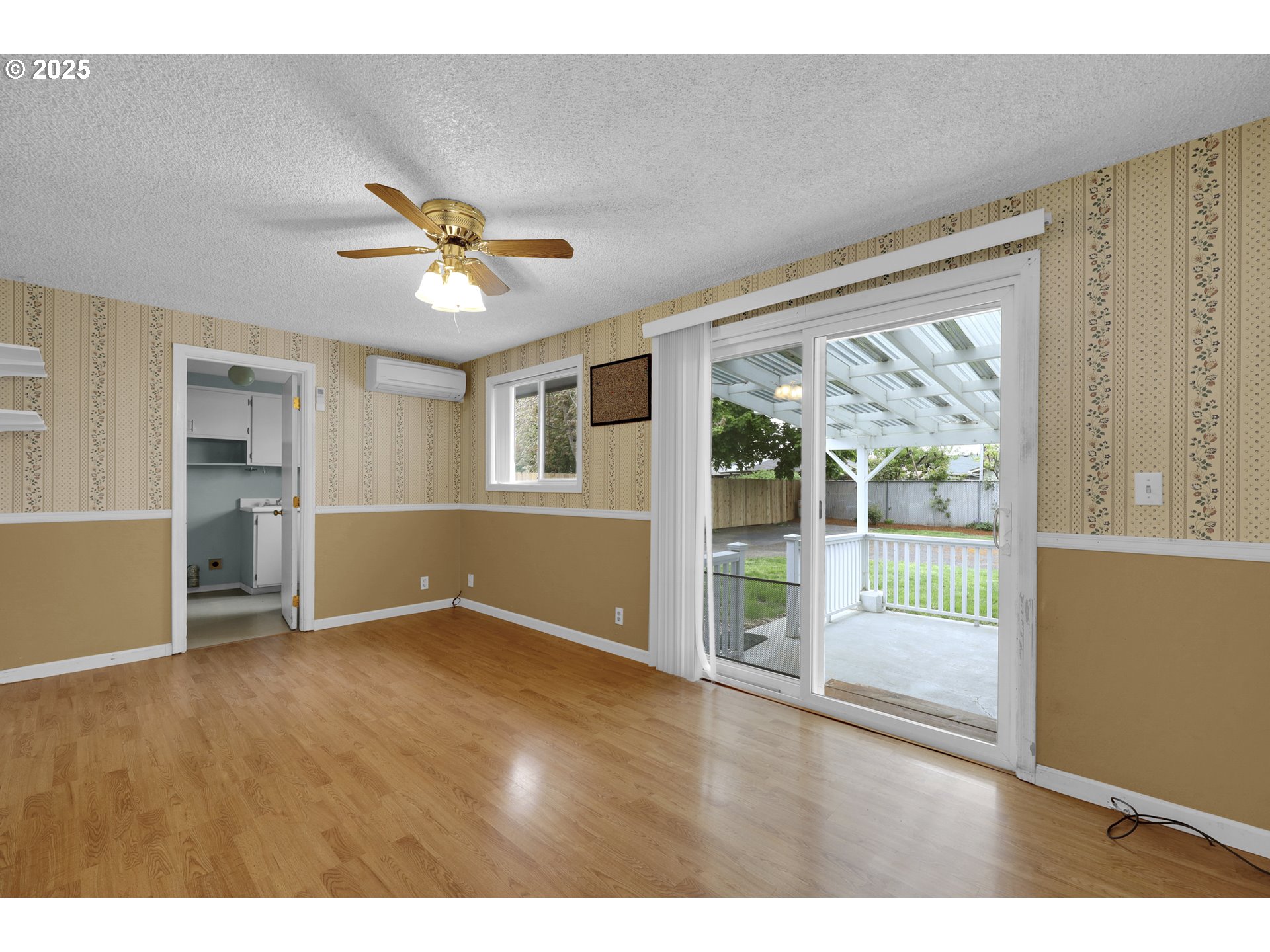 2315 19th Street Springfield, OR 97477 - Photo 22 of 30 a view of an empty room with a window and kitchen view