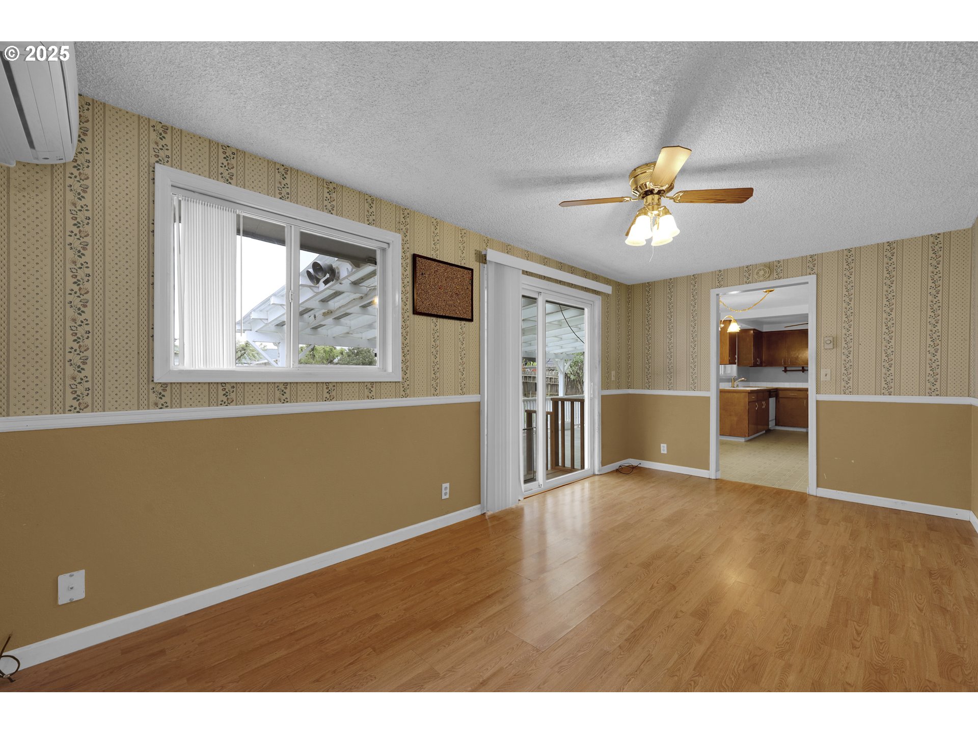2315 19th Street Springfield, OR 97477 - Photo 23 of 30 a view of empty room with wooden floor and window