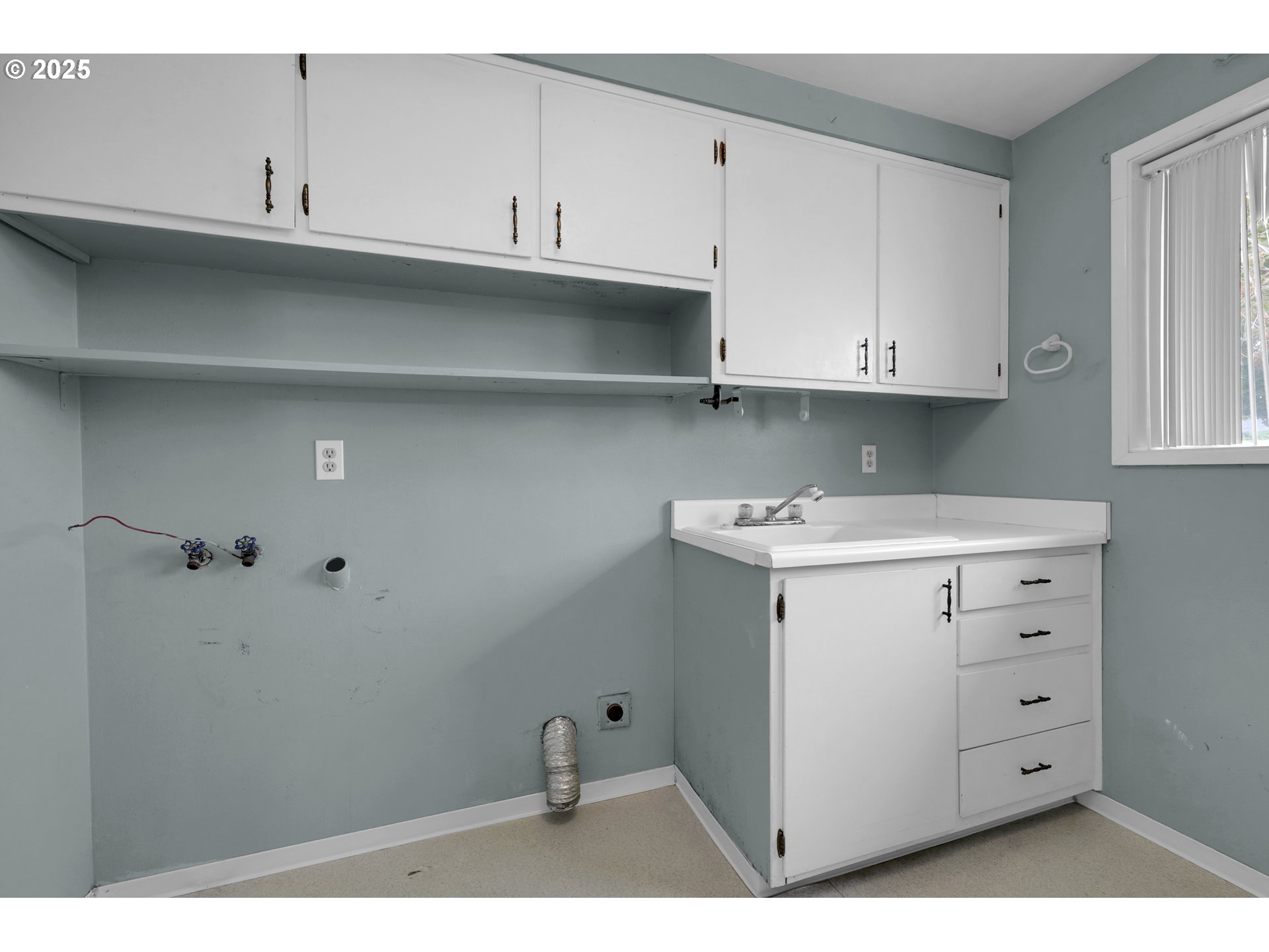 2315 19th Street Springfield, OR 97477 - Photo 24 of 30 a view of cabinets and utility room