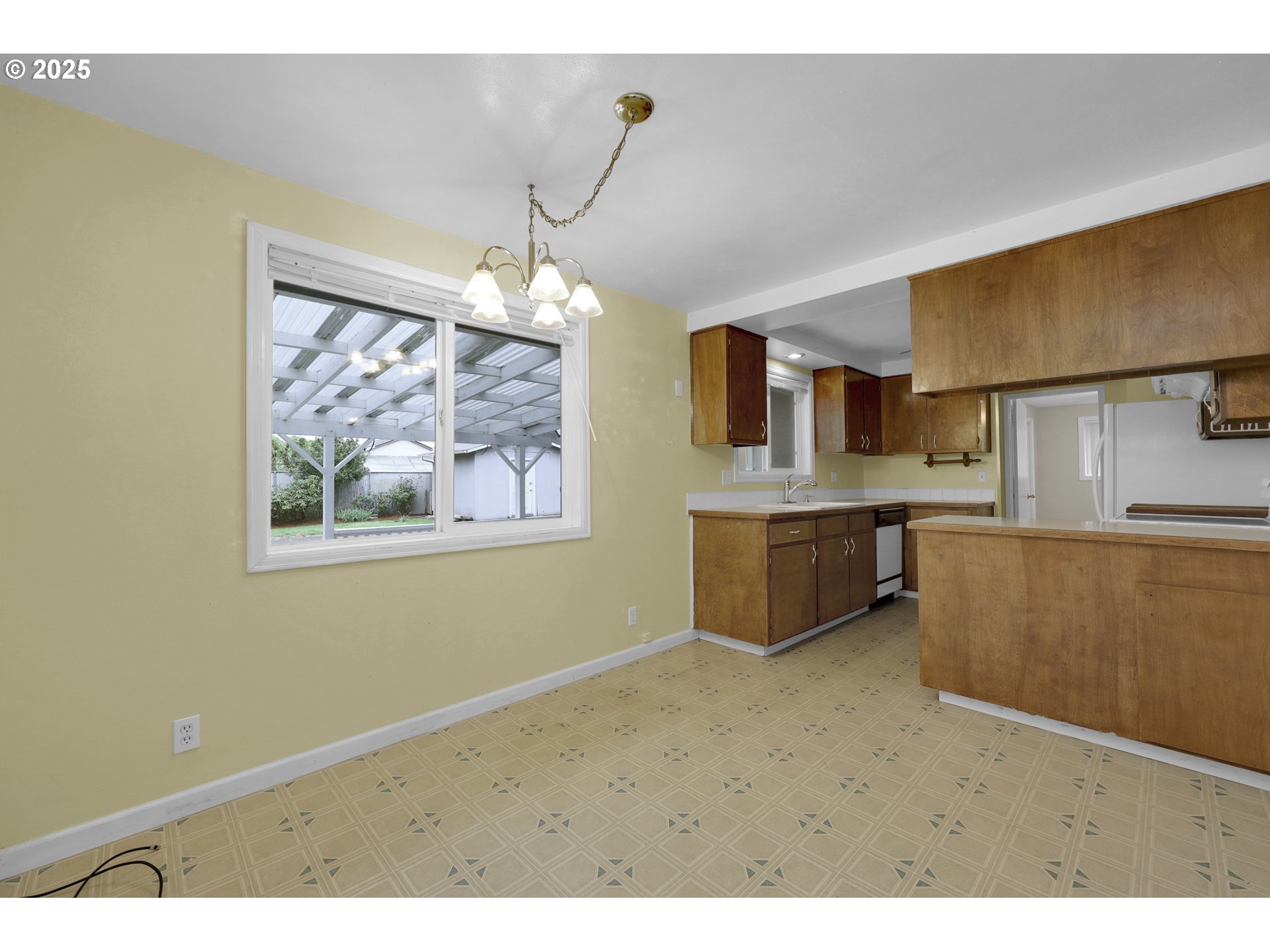 2315 19th Street Springfield, OR 97477 - Photo 7 of 30 a kitchen with stainless steel appliances a stove a sink and a refrigerator
