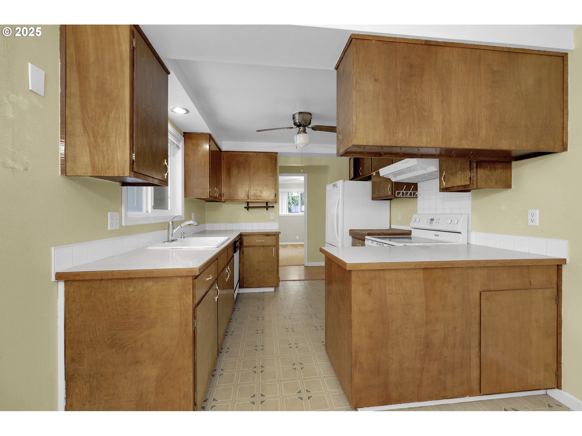 2315 19th Street Springfield, OR 97477 - Photo 9 of 30 a kitchen with sink cabinets and a wooden floor