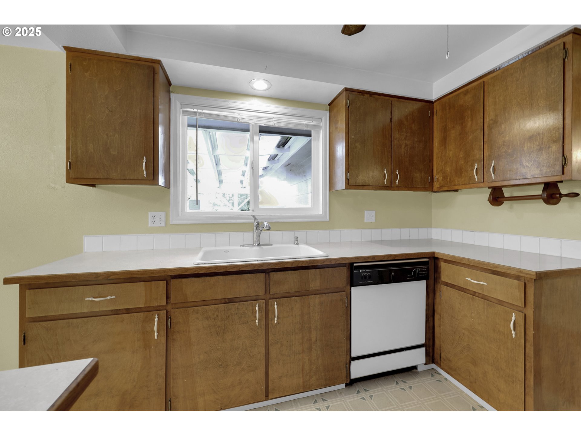 2315 19th Street Springfield, OR 97477 - Photo 10 of 30 a kitchen with a sink cabinets and a window