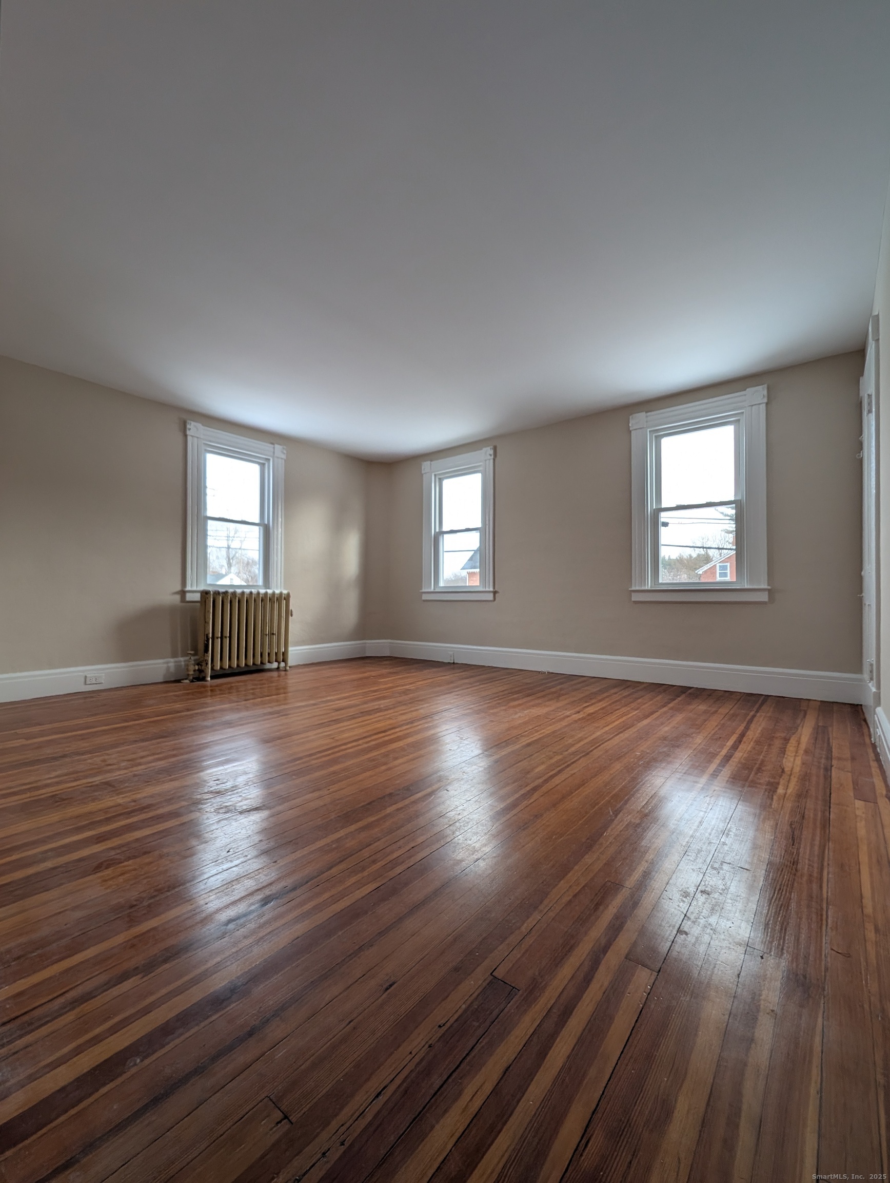 86 Main Street, Unit A East Windsor, CT 06016 - Photo 16 of 17 a view of empty room with wooden floor and fan