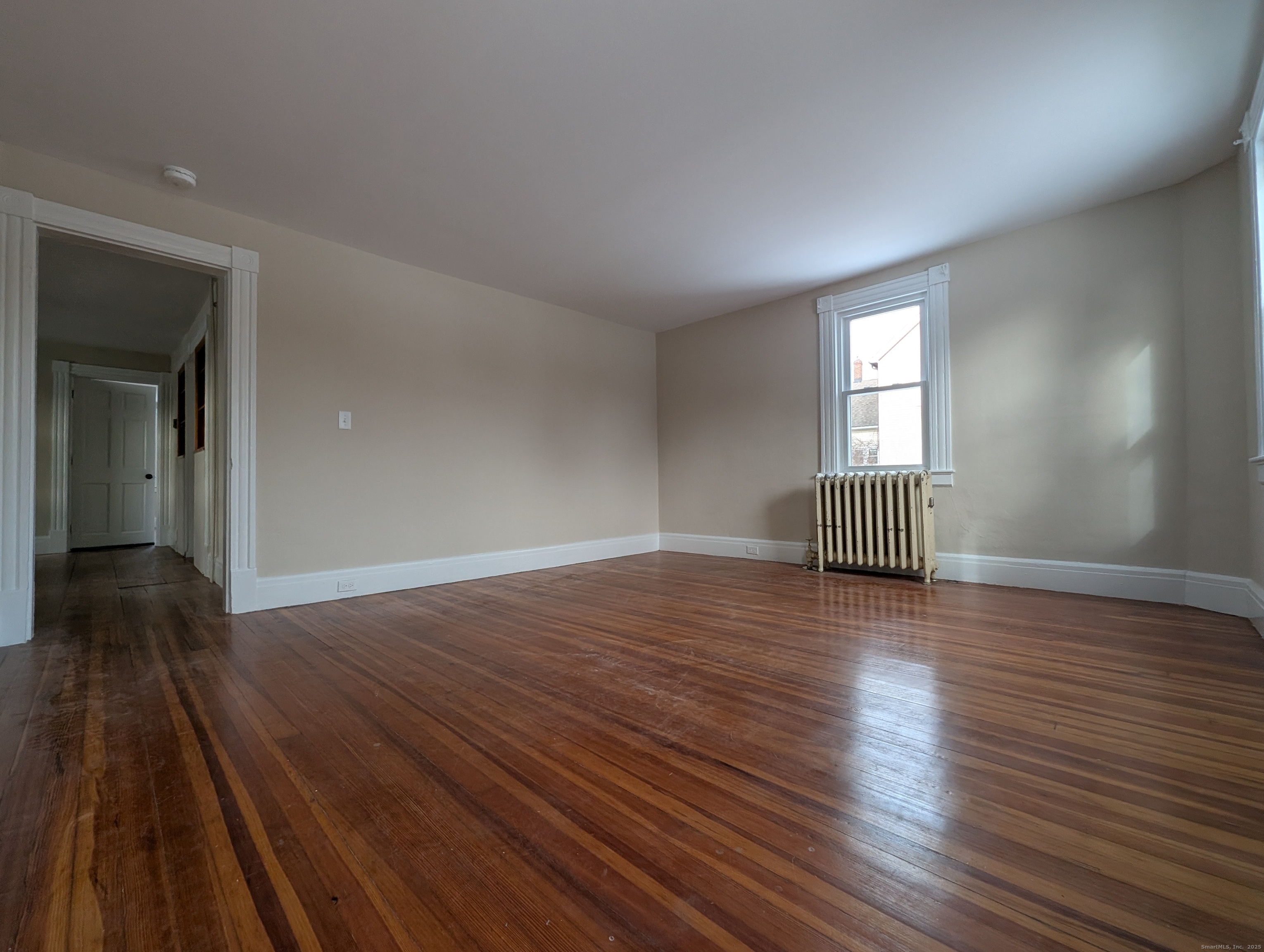 86 Main Street, Unit A East Windsor, CT 06016 - Photo 17 of 17 wooden floor in an empty room with a window
