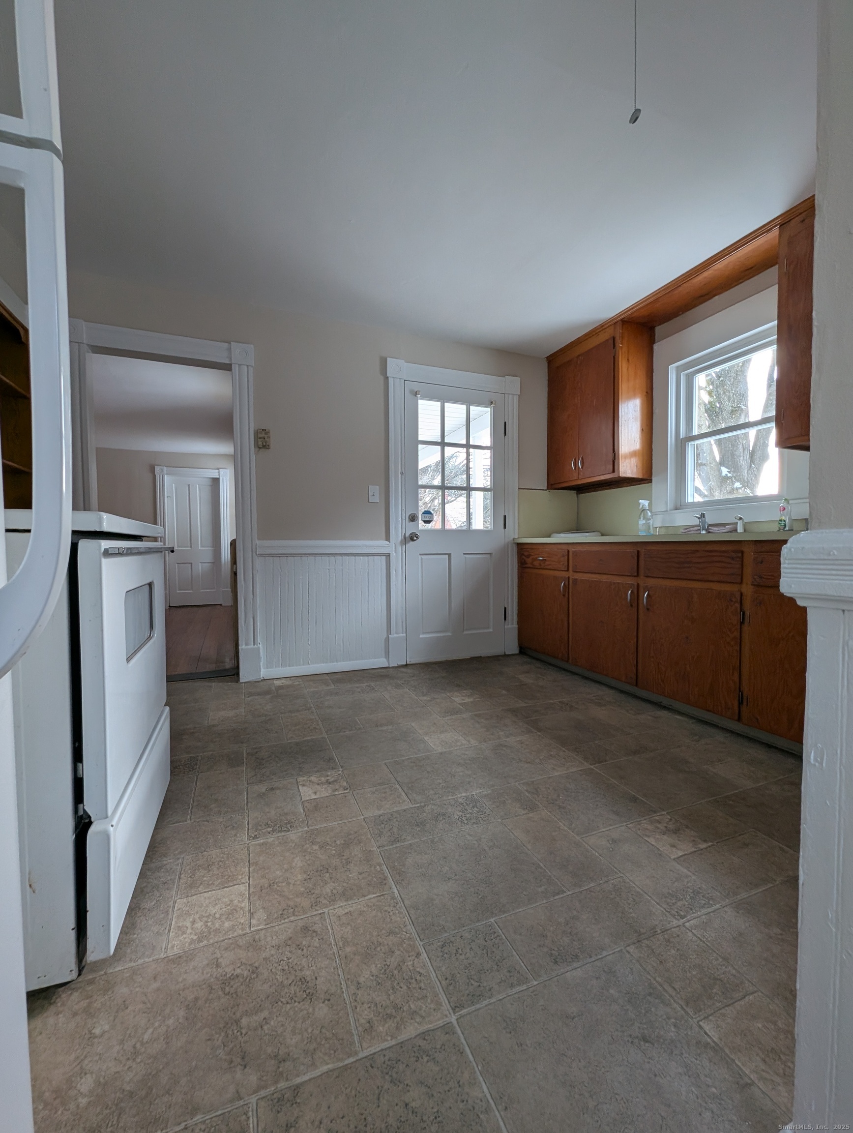 86 Main Street, Unit A East Windsor, CT 06016 - Photo 3 of 17 a view of a kitchen with furniture and windows