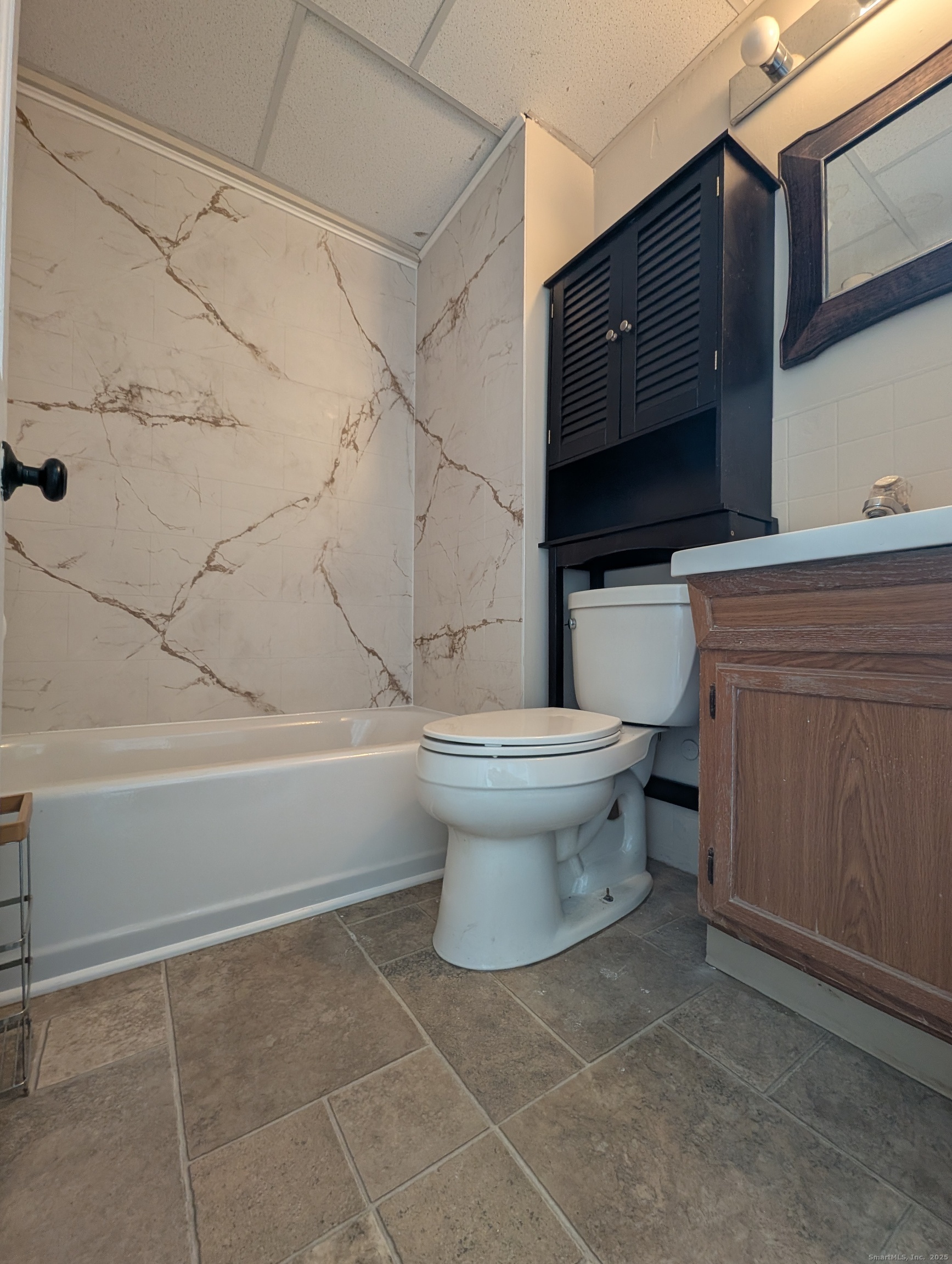86 Main Street, Unit A East Windsor, CT 06016 - Photo 6 of 17 a bathroom with a toilet a sink and bathtub