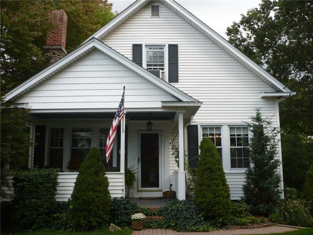 72 Forest Avenue Meriden, CT 06451 - Photo 1 of 1 a view of a white house with a small yard and potted plants