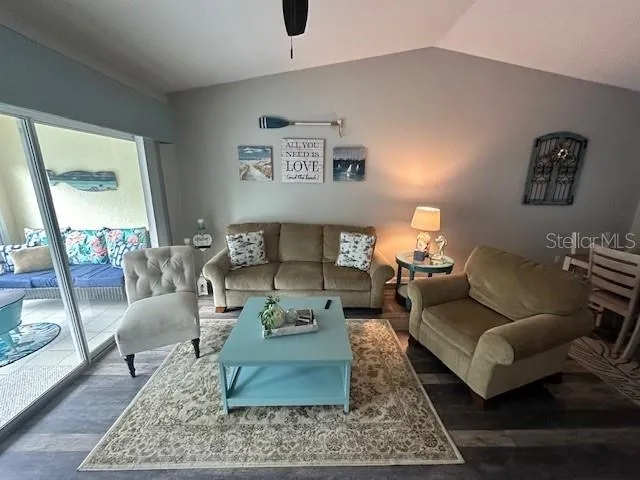 a living room with furniture and a rug