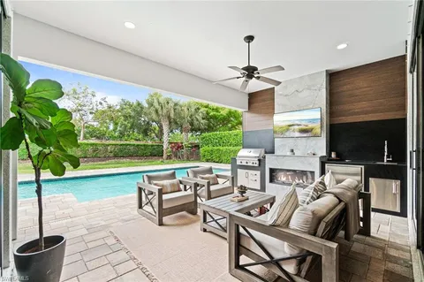 a living room with fireplace furniture and a flat screen tv