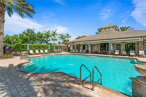 a view of a swimming pool with a patio