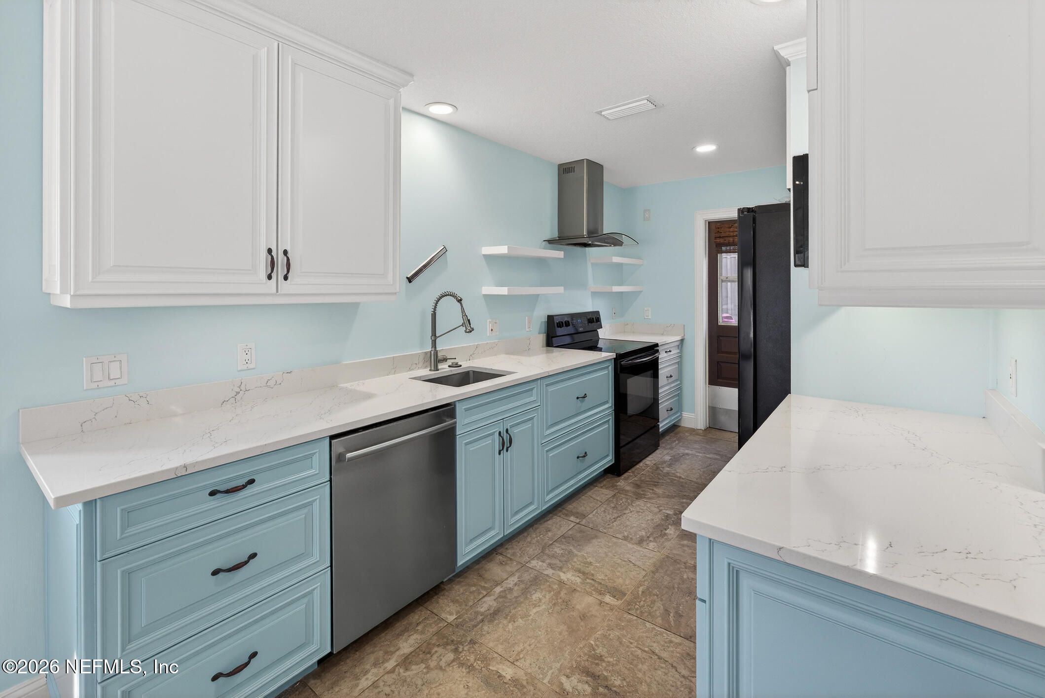 3301 Sea Marsh Road Fernandina Beach, FL 32034 - Photo 15 of 41 a kitchen with a sink a stove and refrigerator