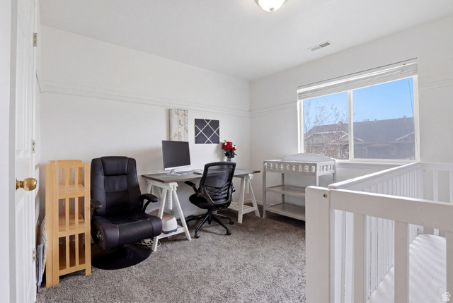 8083 North Ridge Loop East, Unit I 9 Eagle Mountain, UT 84005 - Photo 9 of 17 Bedroom featuring light carpet, an office area, and a crib