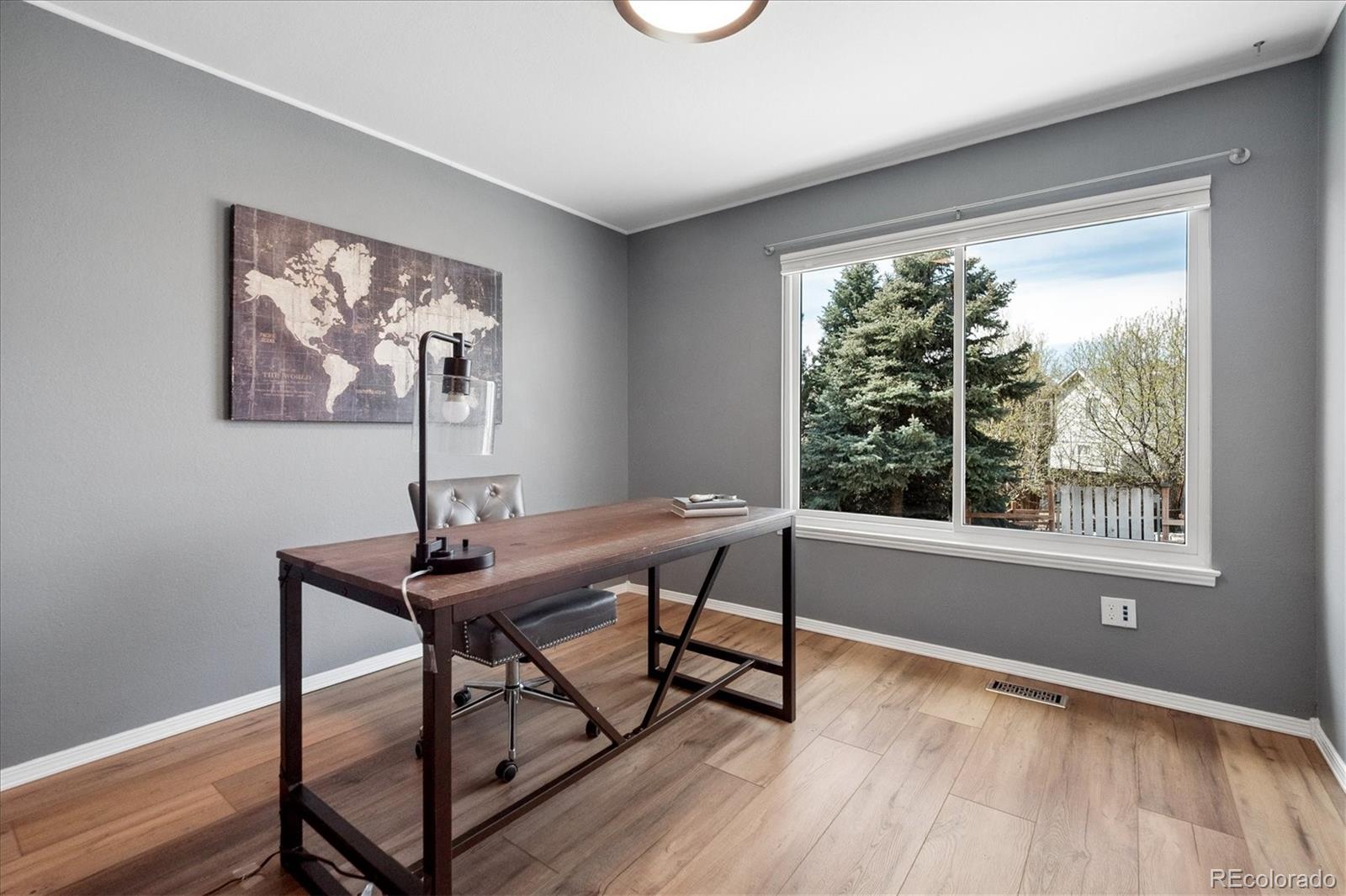 9377 Newport Lane Highlands Ranch, CO 80130 - Photo 16 of 26 a view of a workspace with furniture and a window