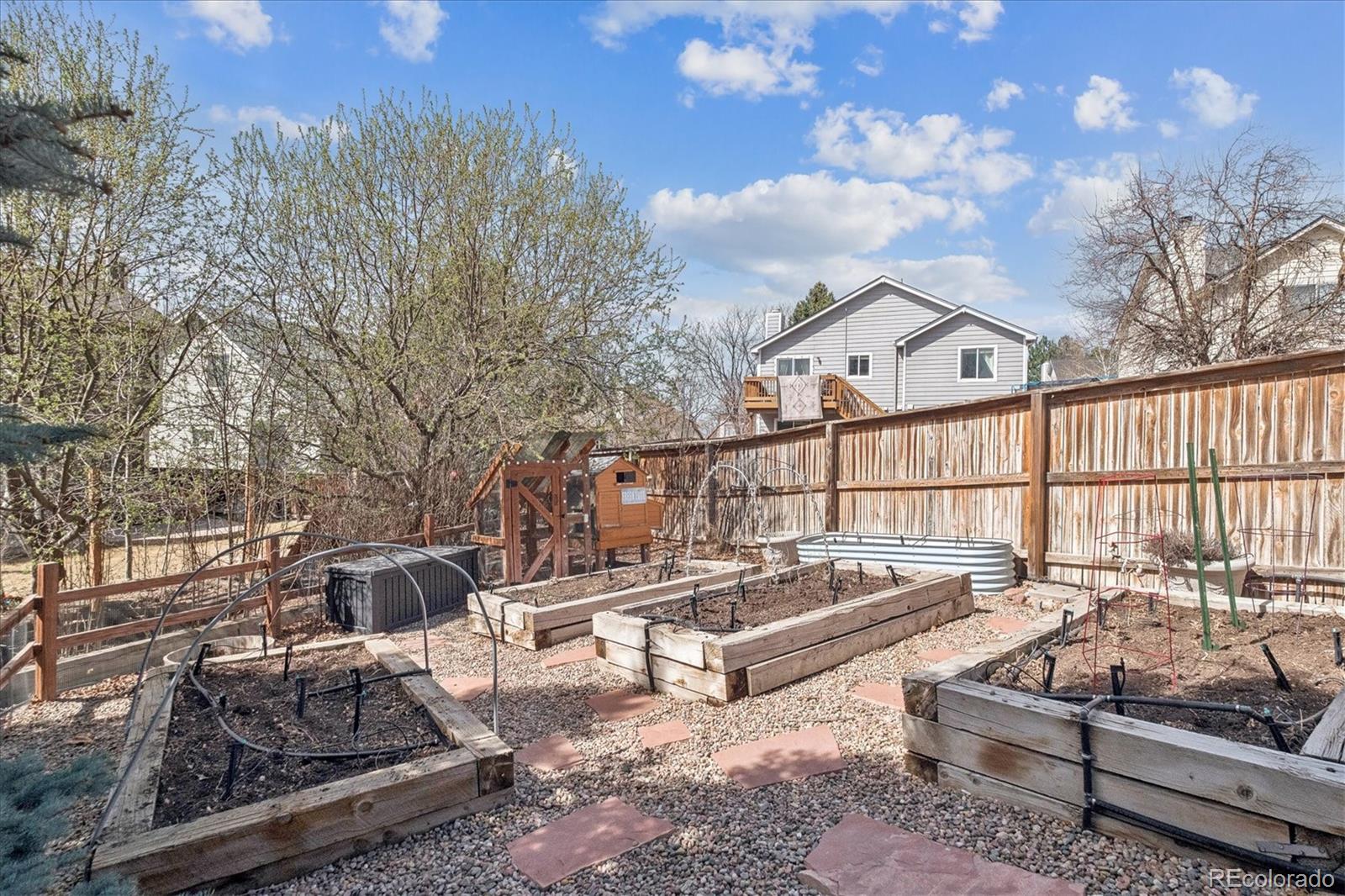 9377 Newport Lane Highlands Ranch, CO 80130 - Photo 18 of 26 a roof deck with couches and potted plants