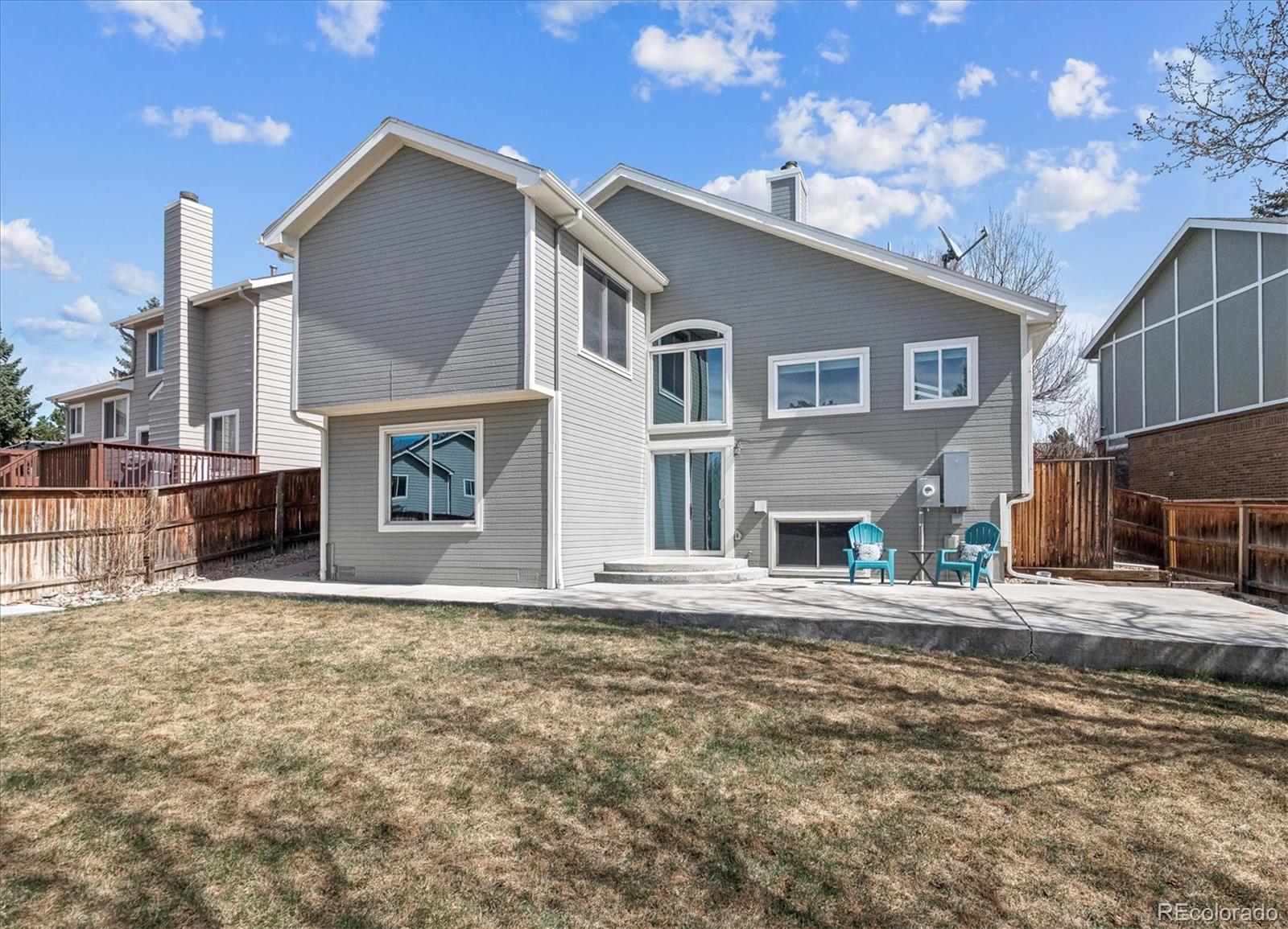 9377 Newport Lane Highlands Ranch, CO 80130 - Photo 19 of 26 a front view of a house with a yard