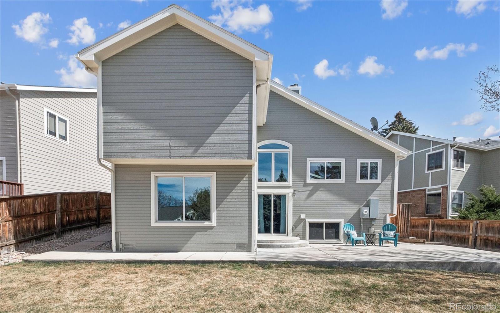 9377 Newport Lane Highlands Ranch, CO 80130 - Photo 20 of 26 a front view of a house with a yard