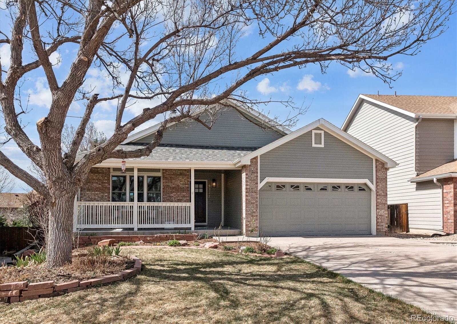9377 Newport Lane Highlands Ranch, CO 80130 - Photo 21 of 26 a front view of a house with a yard