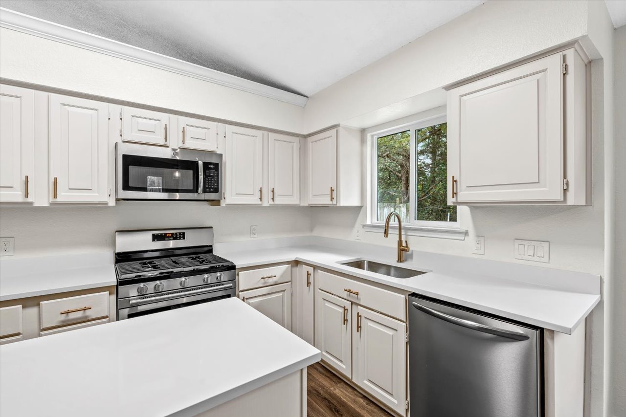4004 Danli Lane Austin, TX 78749 - Photo 21 of 40 a kitchen with cabinets appliances a sink and a window