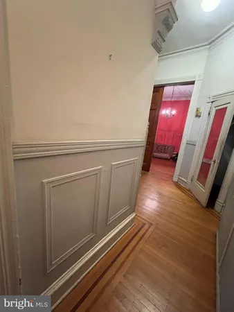 a view of empty room with window and fireplace