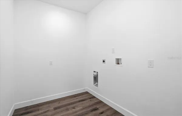 a view of a small space with wooden floor