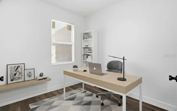 a view of a workspace with furniture