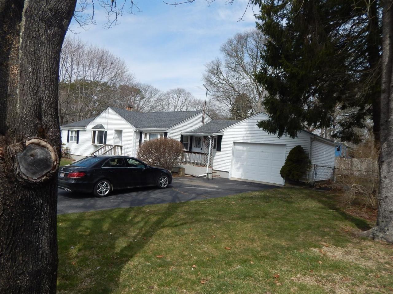 19 Millbrook Road Bourne, MA 02532 - Photo 3 of 7 a house view with a garden space