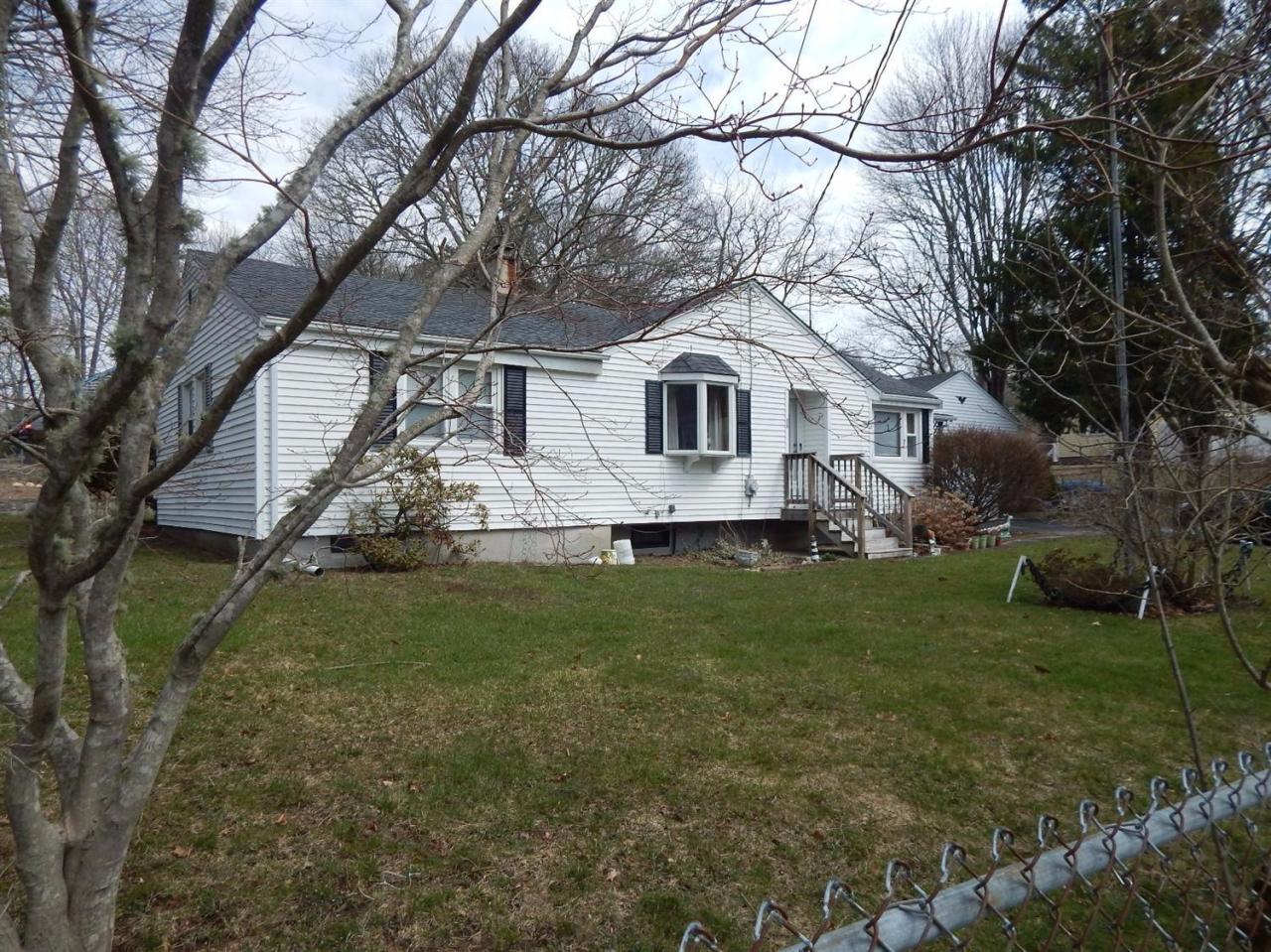 19 Millbrook Road Bourne, MA 02532 - Photo 7 of 7 a front view of house with yard and green space
