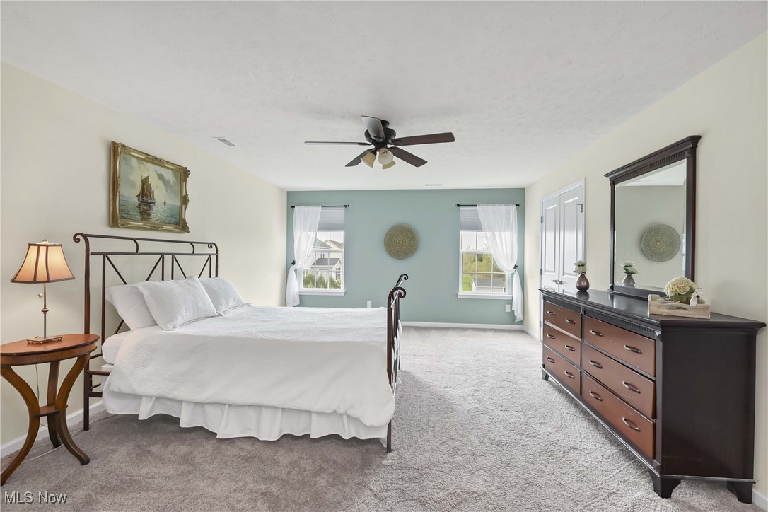 4614 Ridgestone Way Medina, OH 44256 - Photo 11 of 32 Bedroom with baseboards, a ceiling fan, carpet flooring, and visible vents