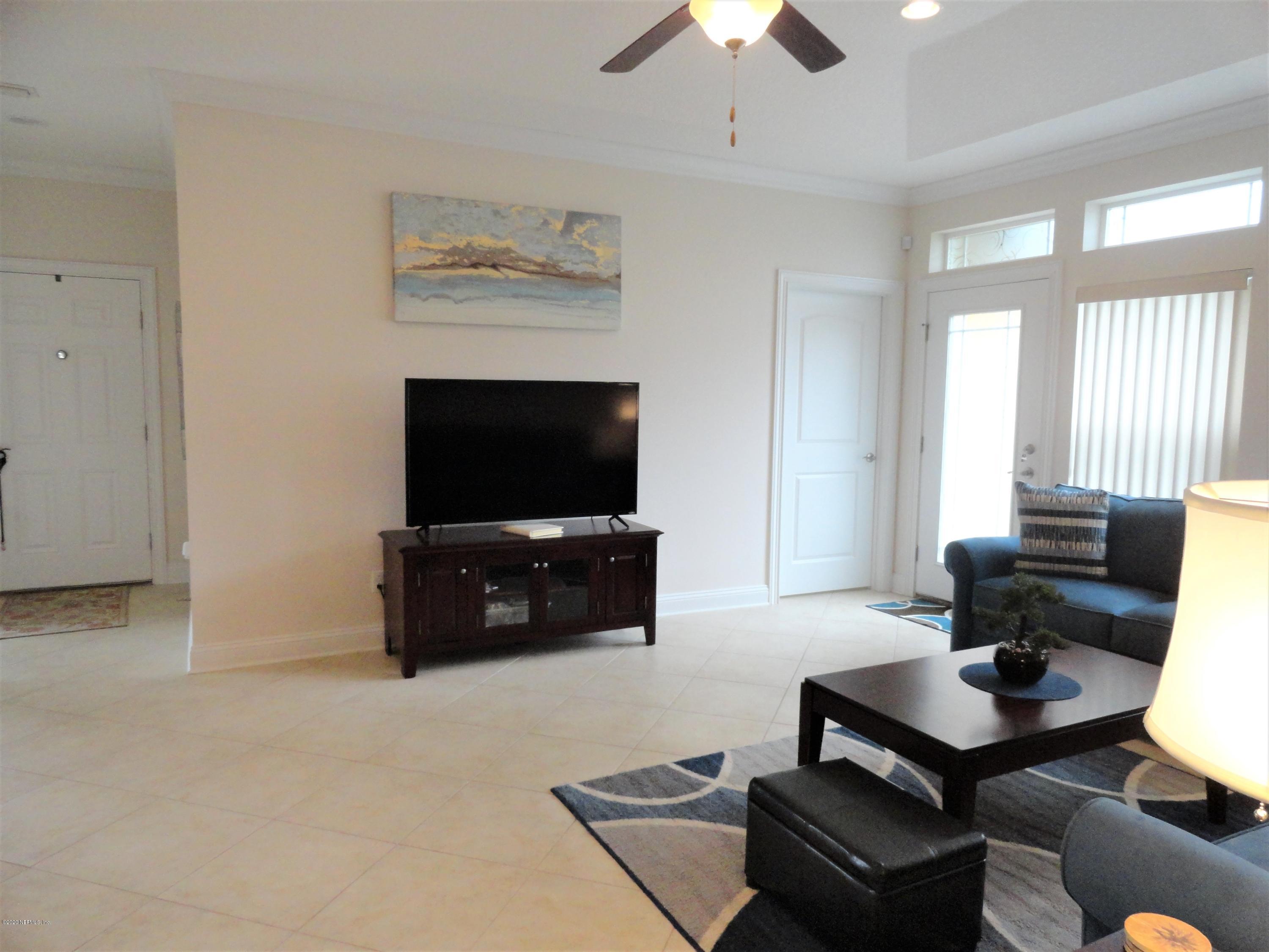 33 Utina Way St. Augustine, FL 32084 - Photo 15 of 30 a living room with furniture and a flat screen tv