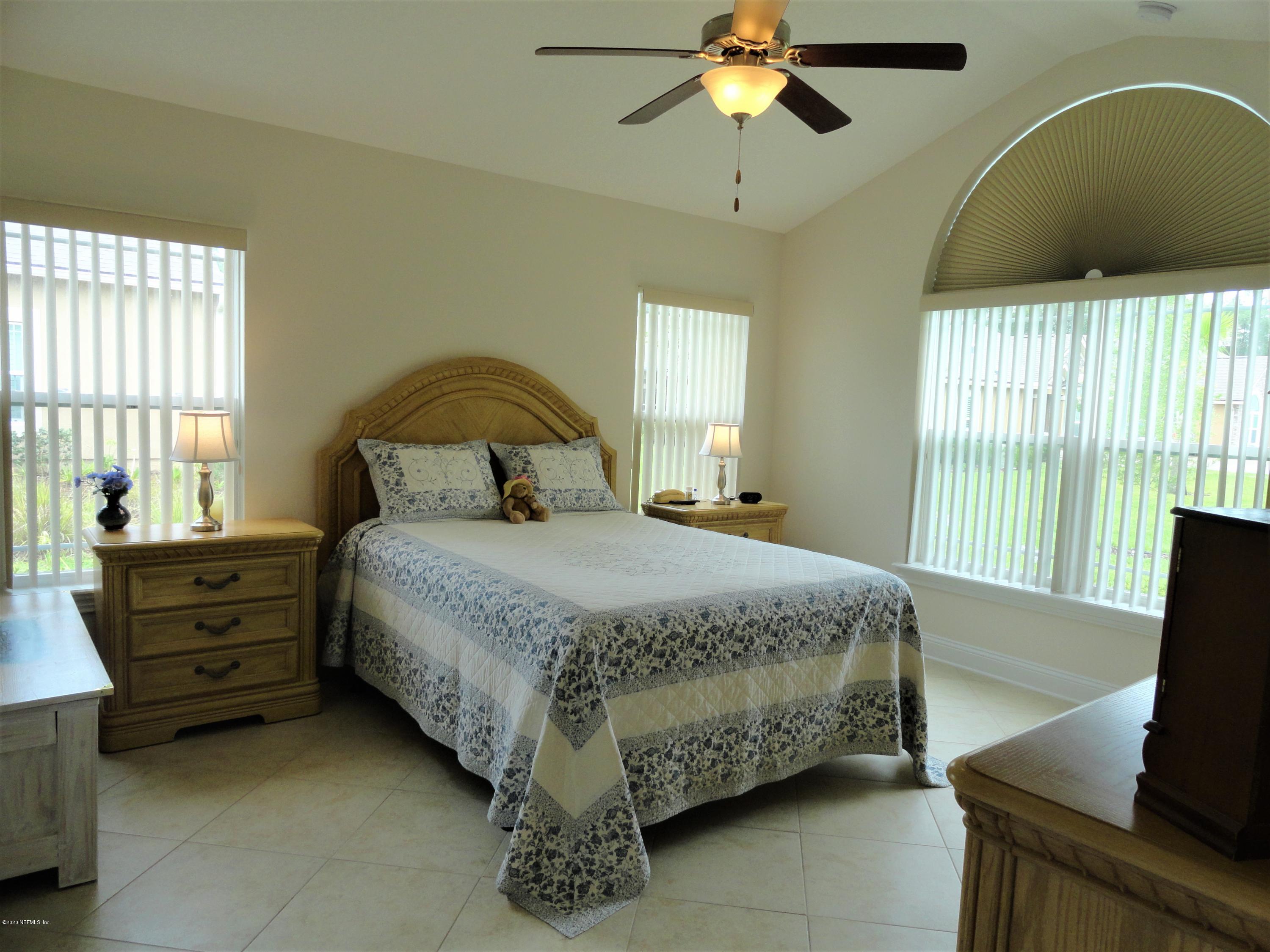 33 Utina Way St. Augustine, FL 32084 - Photo 16 of 30 a bedroom with a bed and window