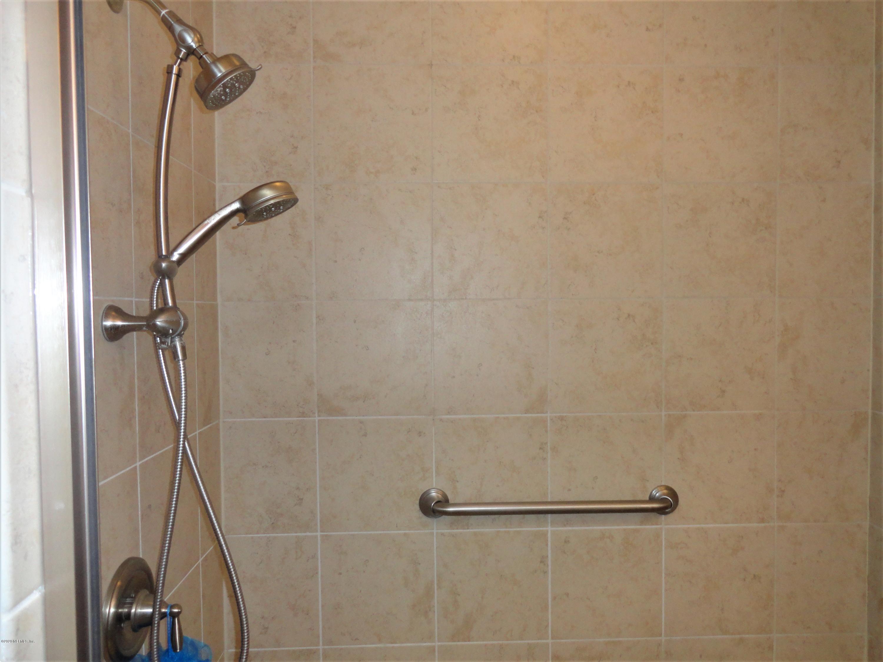 33 Utina Way St. Augustine, FL 32084 - Photo 18 of 30 a bathroom with a shower