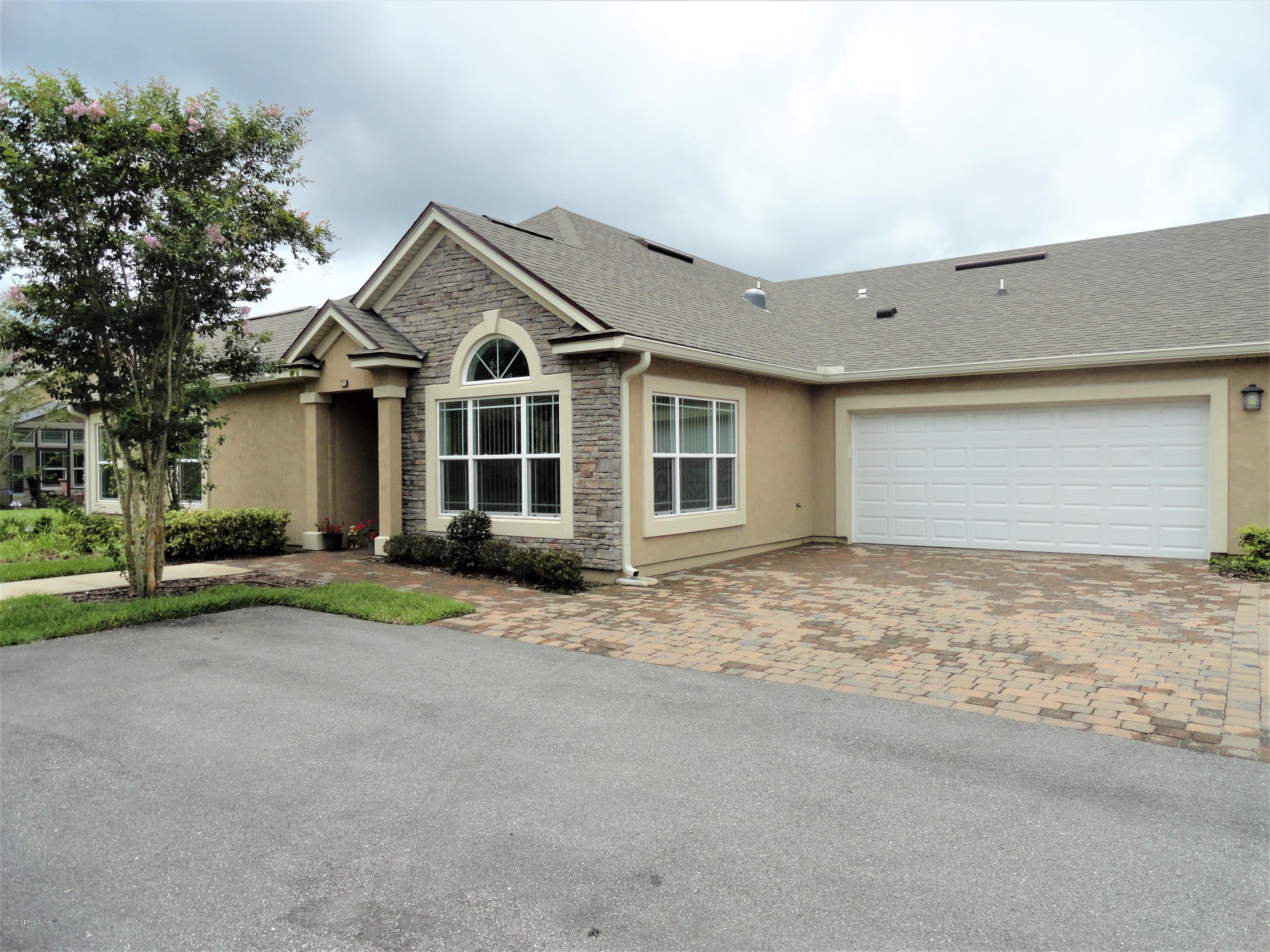 33 Utina Way St. Augustine, FL 32084 - Photo 2 of 30 a front view of a house with a yard and garage