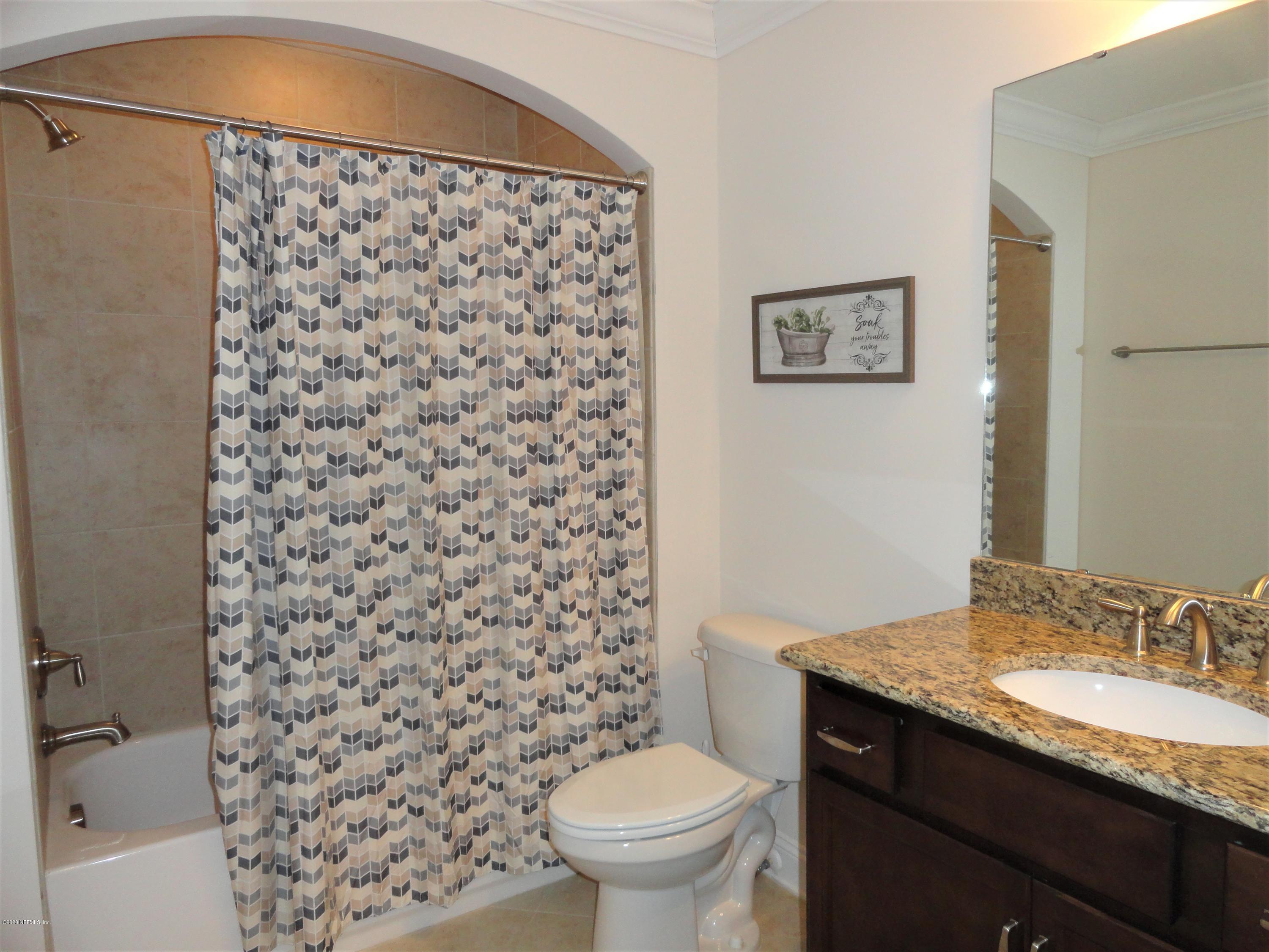 33 Utina Way St. Augustine, FL 32084 - Photo 23 of 30 a bathroom with a granite countertop sink toilet and shower