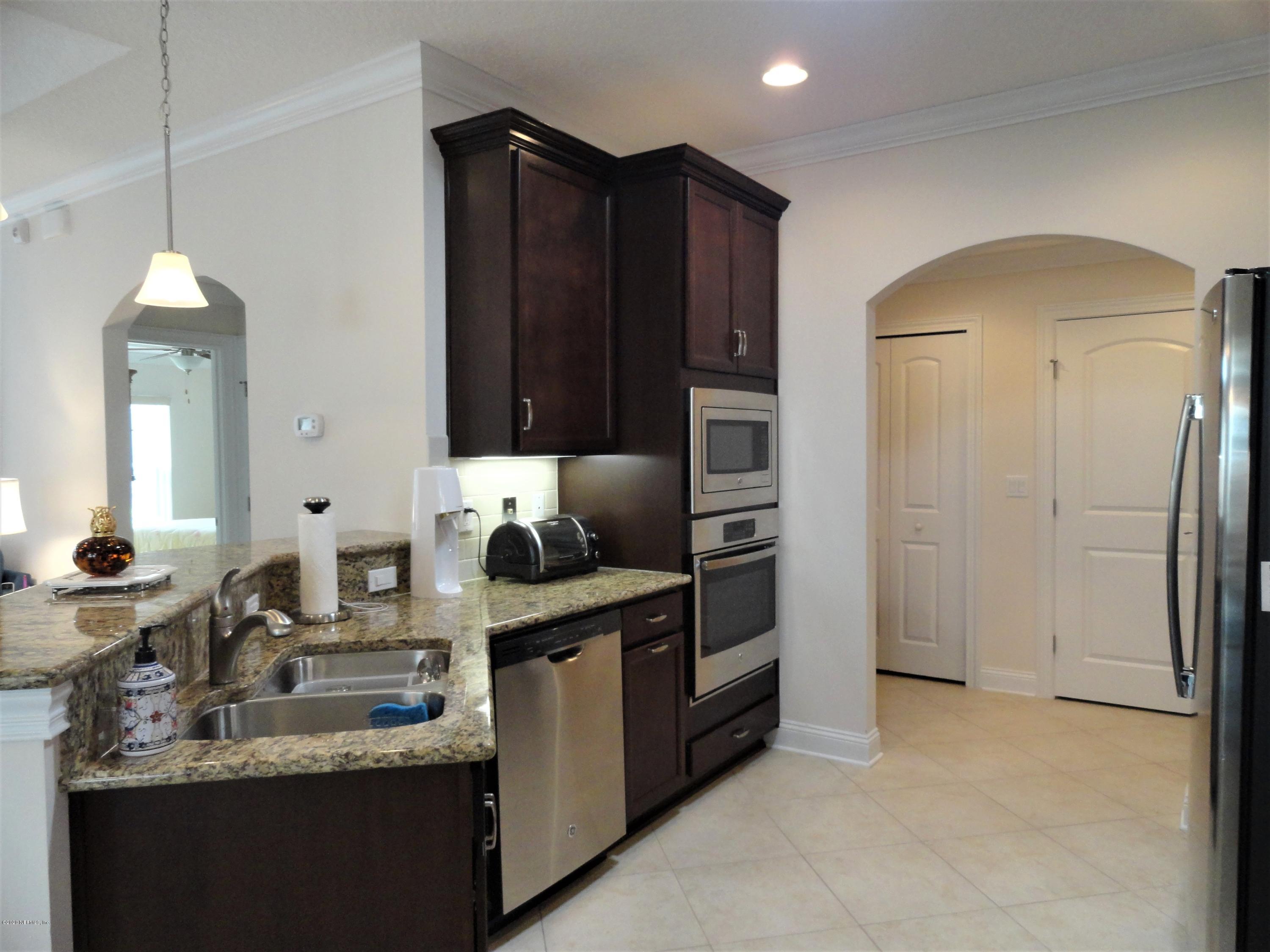 33 Utina Way St. Augustine, FL 32084 - Photo 10 of 30 a kitchen with stainless steel appliances granite countertop a sink stove and refrigerator