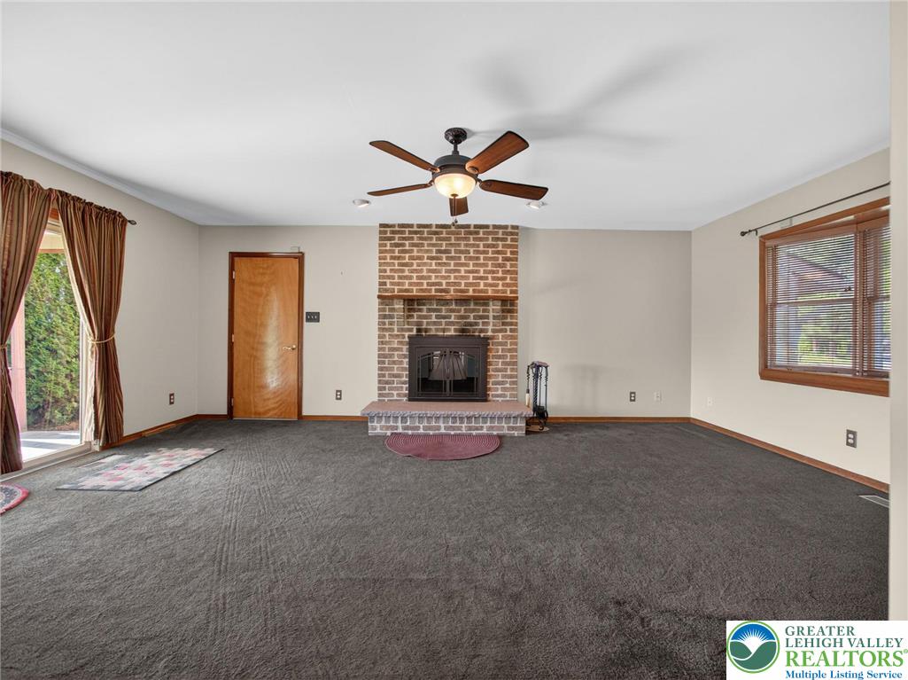 7098 Limerick Square Bath, PA 18014 - Photo 11 of 31 an empty room with windows and fireplace