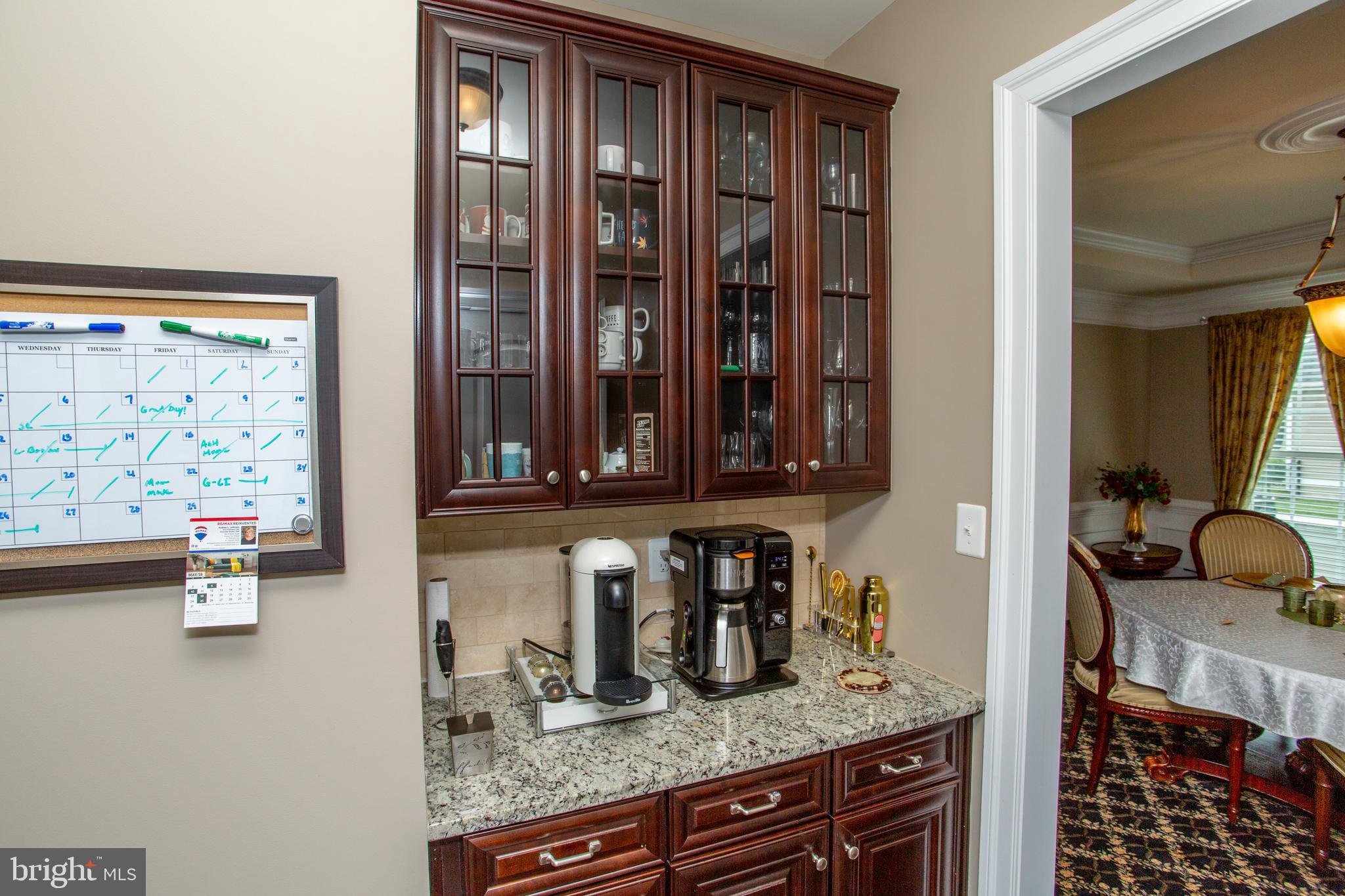4682 Plough Tavern Road Doylestown, PA 18902 - Photo 15 of 42 a kitchen with granite countertop a sink and a refrigerator