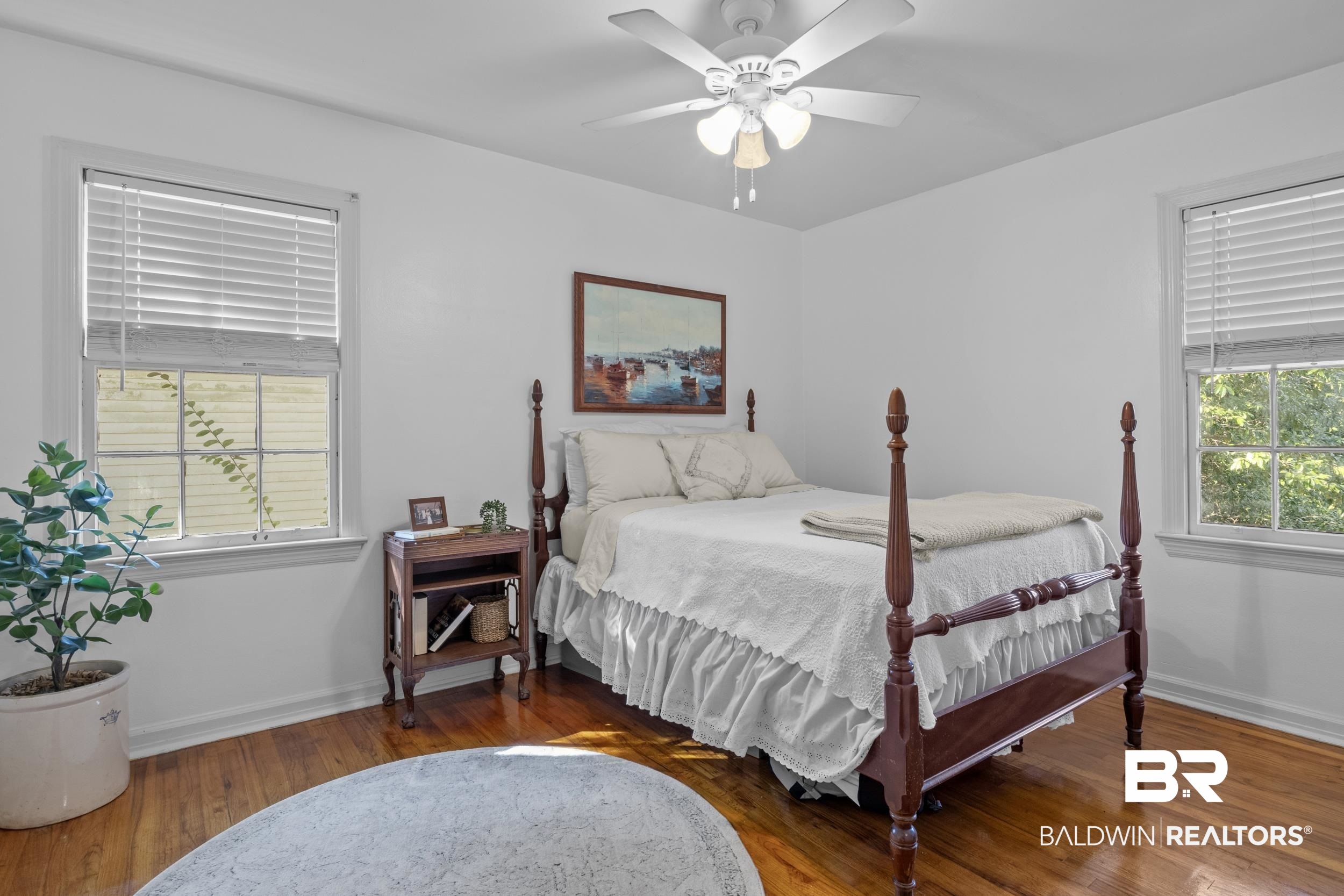 5412 Lusann Drive Mobile, AL 36608 - Photo 24 of 25 Bedroom with ceiling fan, dark hardwood / wood-style floors, and multiple windows