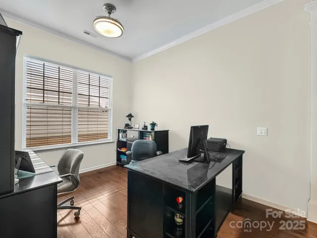 a view of a workspace with furniture