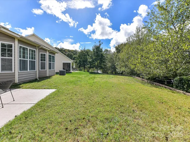 a view of a backyard with a garden