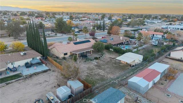 an aerial view of houses with a swimming pool