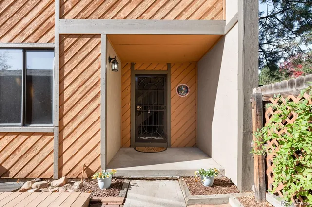 a view of balcony with wooden floor and bench