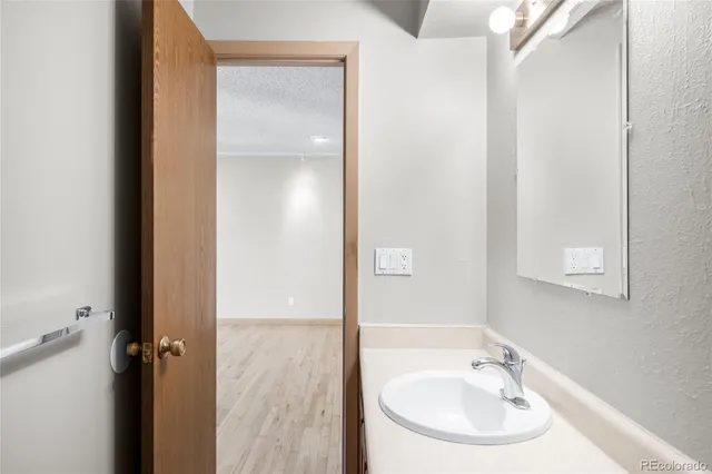 a bathroom with a glass shower door