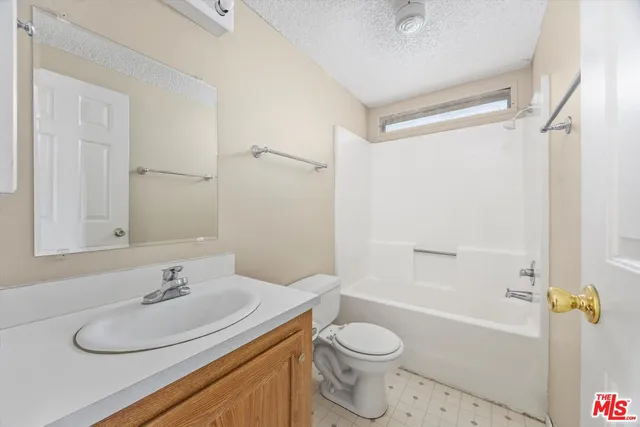 a bathroom with a sink toilet and a bathtub
