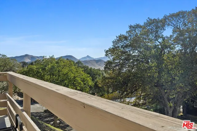 a view of a balcony with an outdoor space