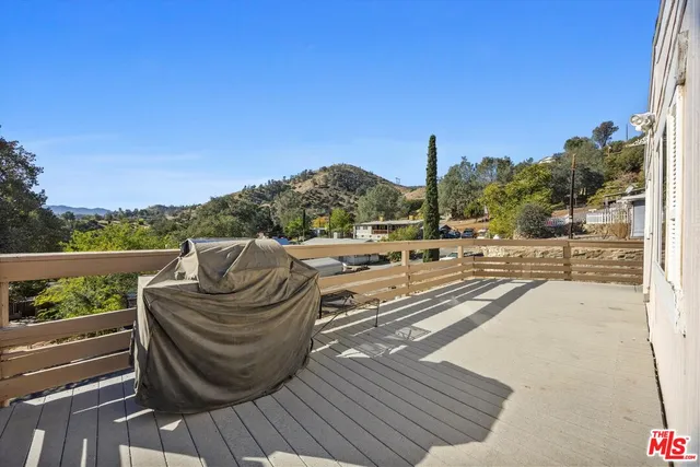 a view of a balcony with chairs