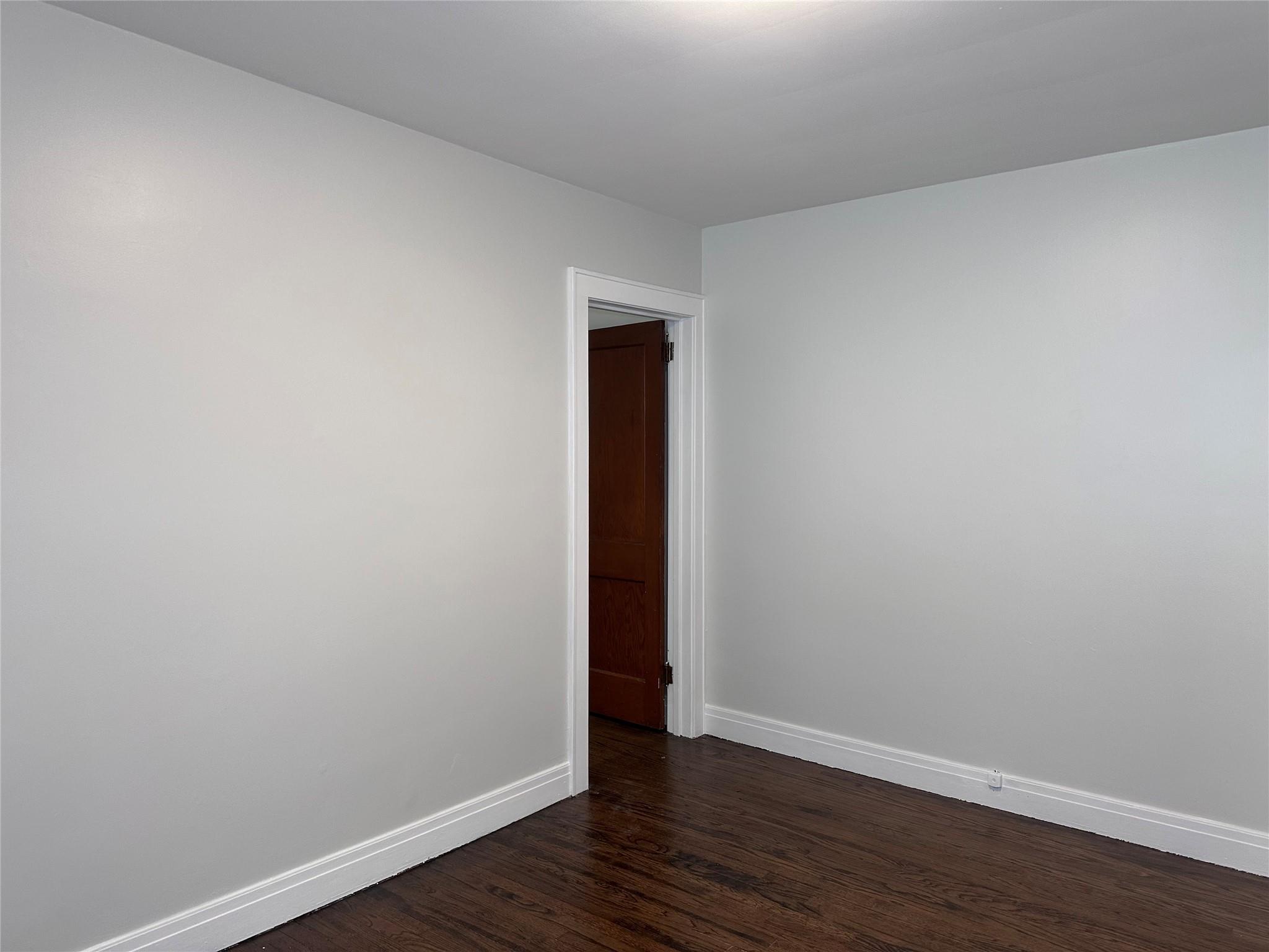 39 Adams Street, Unit 2 Poughkeepsie, NY 12601 - Photo 6 of 12 a view of an empty room with wooden floor